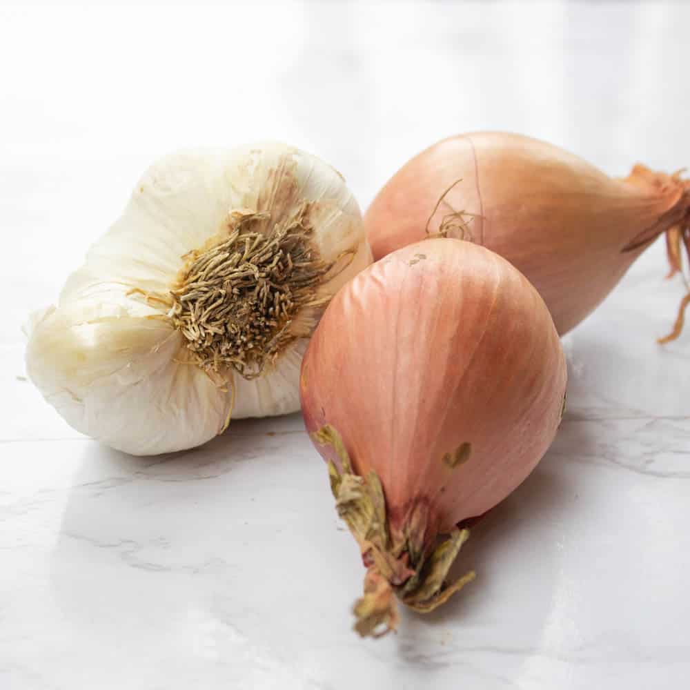 Shallots and garlic for pea risotto